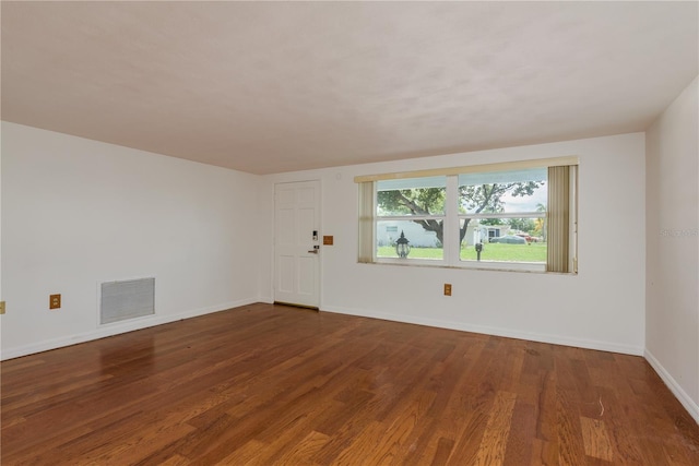 3547 Morley Dr, New Port Richey, FL 34652 - unfurnished room with wood finished floors and baseboards