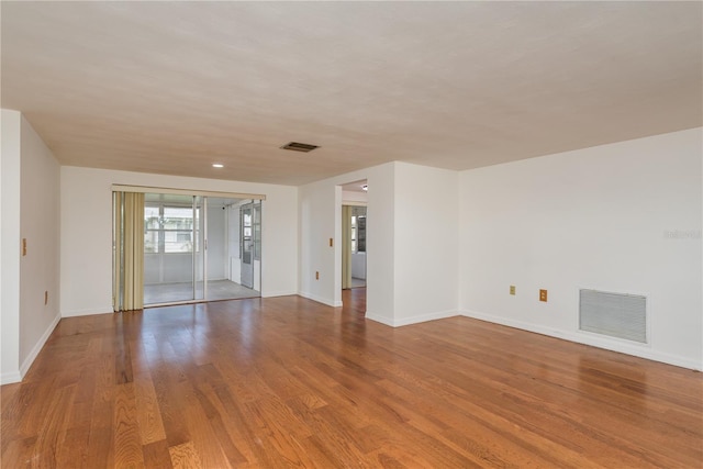 3547 Morley Dr, New Port Richey, FL 34652 - empty room featuring baseboards and wood finished floors