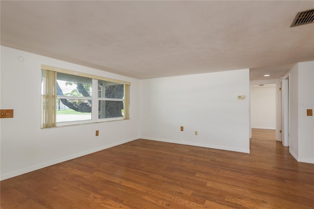 3547 Morley Dr, New Port Richey, FL 34652 - empty room with wood finished floors and baseboards
