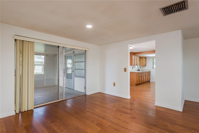 3547 Morley Dr, New Port Richey, FL 34652 - spare room featuring wood finished floors and recessed lighting