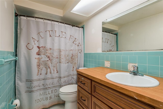 3547 Morley Dr, New Port Richey, FL 34652 - bathroom with tile walls, vanity, wainscoting, and a shower with shower curtain