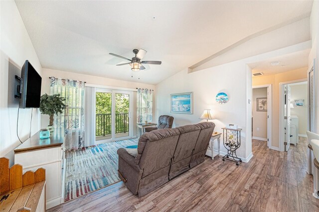 5065 Royal Palms Way Unit 303, New Port Richey, FL 34652 - living area featuring vaulted ceiling, ceiling fan, and wood finished floors
