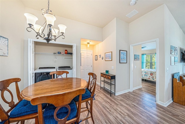 5065 Royal Palms Way Unit 303, New Port Richey, FL 34652 - dining space with light wood finished floors and a chandelier