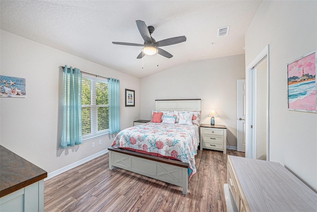 5065 Royal Palms Way Unit 303, New Port Richey, FL 34652 - bedroom featuring wood finished floors, lofted ceiling, and ceiling fan