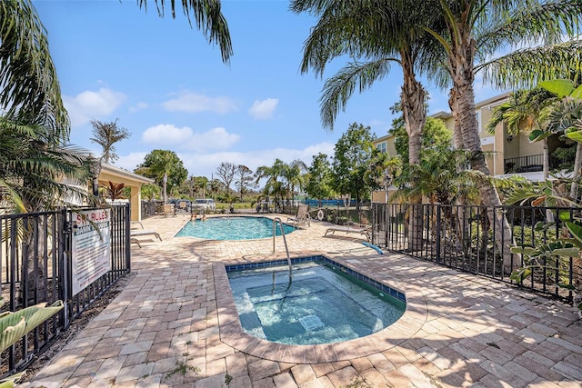 5065 Royal Palms Way Unit 303, New Port Richey, FL 34652 - community pool with a community hot tub and a patio area