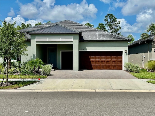 10864 Banyan Breeze Blvd, Land O Lakes, FL 34638 - view of front of property featuring a garage, stucco siding, and driveway