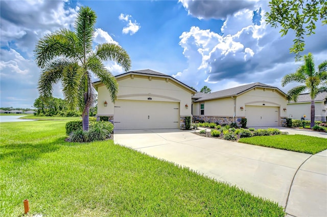 11619 Cambium Crown Dr, Riverview, FL 33569 - view of front of home featuring stucco siding, concrete driveway, a front yard, and a garage