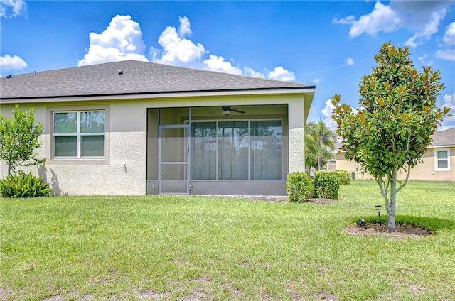 11619 Cambium Crown Dr, Riverview, FL 33569 - back of property with stucco siding, a yard, a sunroom, ceiling fan, and a shingled roof