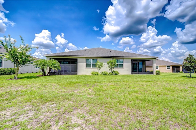 11619 Cambium Crown Dr, Riverview, FL 33569 - back of house with a sunroom, stucco siding, and a yard