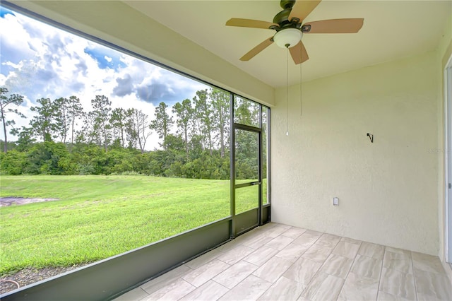 11619 Cambium Crown Dr, Riverview, FL 33569 - unfurnished sunroom with ceiling fan and view of scattered trees
