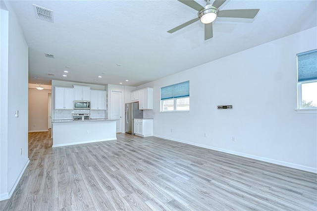 11619 Cambium Crown Dr, Riverview, FL 33569 - unfurnished living room with ceiling fan, light wood finished floors, and recessed lighting