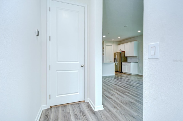 11619 Cambium Crown Dr, Riverview, FL 33569 - hallway with light wood-style floors, recessed lighting, and a textured wall