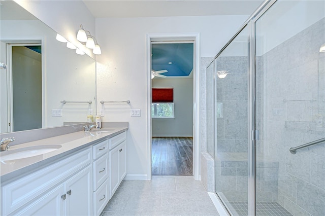 11619 Cambium Crown Dr, Riverview, FL 33569 - full bathroom featuring double vanity, a shower stall, a ceiling fan, and tile patterned floors