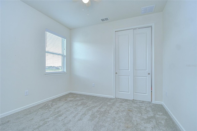 11619 Cambium Crown Dr, Riverview, FL 33569 - unfurnished bedroom with carpet flooring, a closet, and a ceiling fan