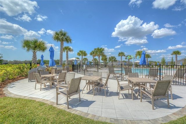 11619 Cambium Crown Dr, Riverview, FL 33569 - view of patio with a community pool and outdoor dining area