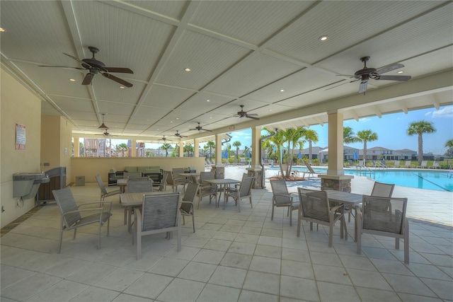 11619 Cambium Crown Dr, Riverview, FL 33569 - view of patio / terrace with a ceiling fan, outdoor dining area, and a community pool