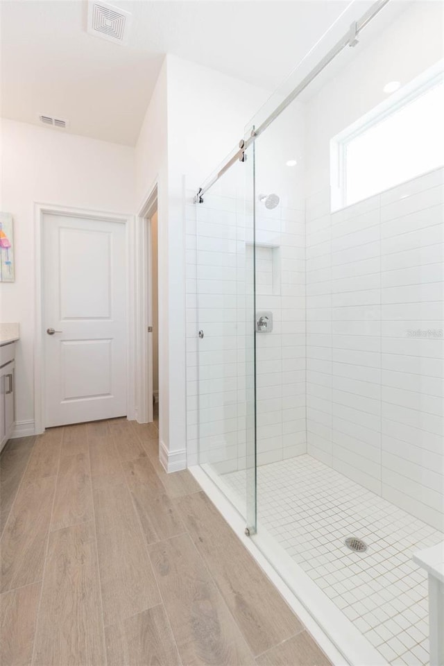 11717 74th Cir E, Palmetto, FL 34221 - full bath with a shower stall, wood finished floors, and vanity