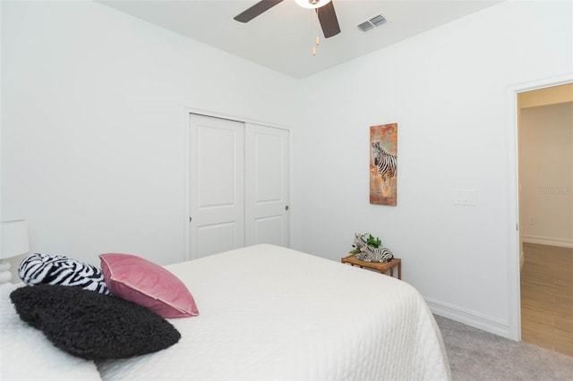 11717 74th Cir E, Palmetto, FL 34221 - bedroom featuring a closet, carpet floors, and a ceiling fan