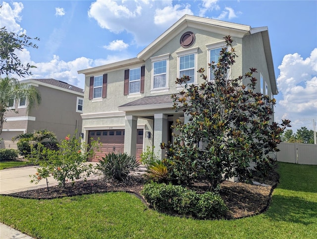 32599 Natural Bridge Rd, Wesley Chapel, FL 33543 - view of front of home with stucco siding, an attached garage, and driveway