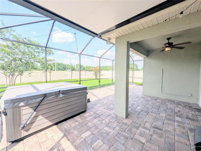 32599 Natural Bridge Rd, Wesley Chapel, FL 33543 - view of patio / terrace featuring a hot tub, a ceiling fan, and a lanai