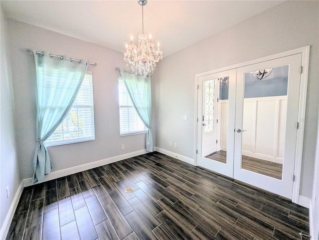 32599 Natural Bridge Rd, Wesley Chapel, FL 33543 - spare room with a chandelier, wood finish floors, and french doors