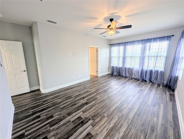 32599 Natural Bridge Rd, Wesley Chapel, FL 33543 - empty room with dark wood-style flooring and ceiling fan