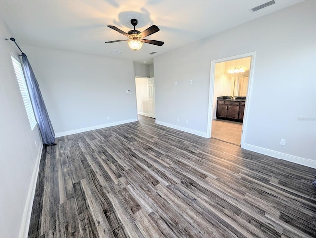 32599 Natural Bridge Rd, Wesley Chapel, FL 33543 - unfurnished bedroom with wood finished floors, ensuite bath, and a ceiling fan