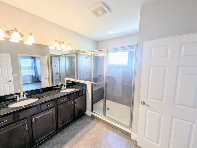 32599 Natural Bridge Rd, Wesley Chapel, FL 33543 - bathroom featuring healthy amount of natural light, double vanity, a shower stall, and tile patterned floors