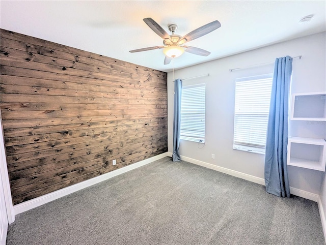 32599 Natural Bridge Rd, Wesley Chapel, FL 33543 - unfurnished room with carpet, wooden walls, and ceiling fan