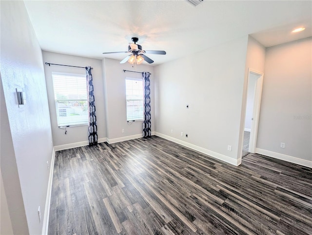 32599 Natural Bridge Rd, Wesley Chapel, FL 33543 - empty room with a ceiling fan and dark wood-style flooring