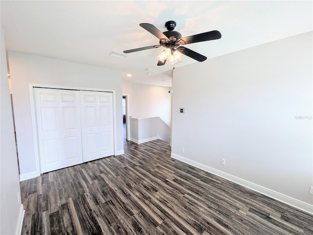 32599 Natural Bridge Rd, Wesley Chapel, FL 33543 - unfurnished bedroom with dark wood finished floors, a closet, and ceiling fan