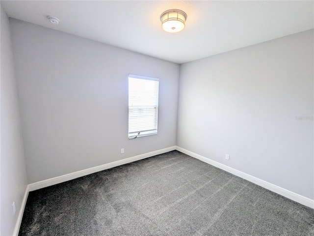 32599 Natural Bridge Rd, Wesley Chapel, FL 33543 - unfurnished room featuring a smoke detector and dark colored carpet