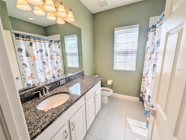32599 Natural Bridge Rd, Wesley Chapel, FL 33543 - full bath featuring vanity, tile patterned flooring, curtained shower, and a chandelier