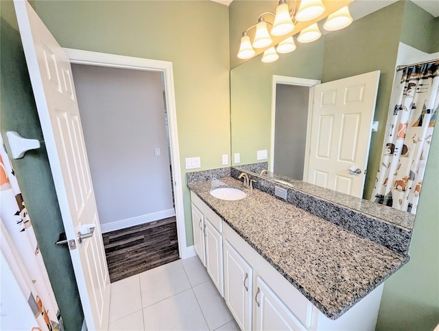 32599 Natural Bridge Rd, Wesley Chapel, FL 33543 - bathroom featuring vanity, tile patterned floors, a chandelier, and a shower with shower curtain