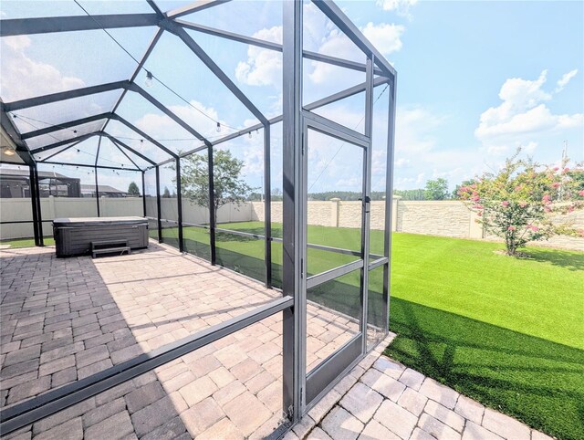 32599 Natural Bridge Rd, Wesley Chapel, FL 33543 - fenced backyard featuring a hot tub, a patio area, and glass enclosure
