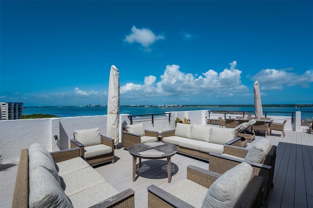 1581 Gulf Blvd Unit 701N, Clearwater Beach, FL 33767 - view of patio / terrace featuring outdoor lounge area and a deck with water view