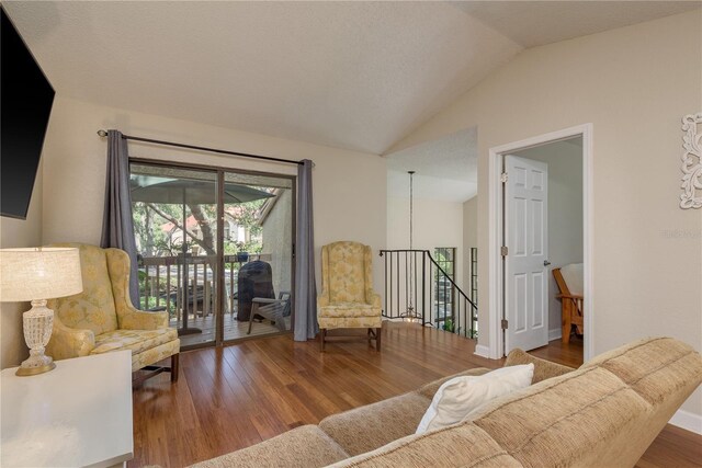 247 Los Prados Dr Unit 1123, Safety Harbor, FL 34695 - living area with wood finished floors and vaulted ceiling