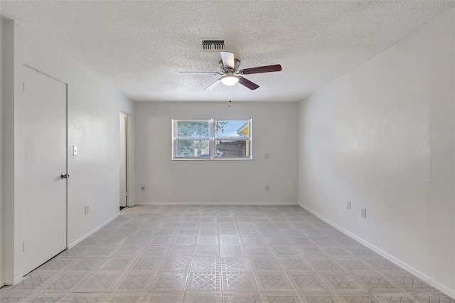 1903 24th St, Sarasota, FL 34234 - empty room with ceiling fan and a textured ceiling