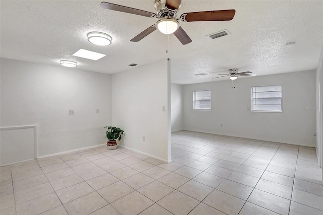 1903 24th St, Sarasota, FL 34234 - spare room featuring a textured ceiling, ceiling fan, and light tile patterned flooring