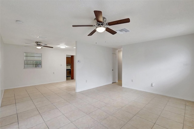 1903 24th St, Sarasota, FL 34234 - spare room featuring a ceiling fan, light tile patterned flooring, a smoke detector, and a textured ceiling