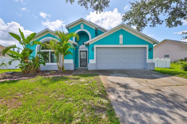 10430 Crestfield Dr, Riverview, FL 33569 - view of front of home with a garage, concrete driveway, and stucco siding