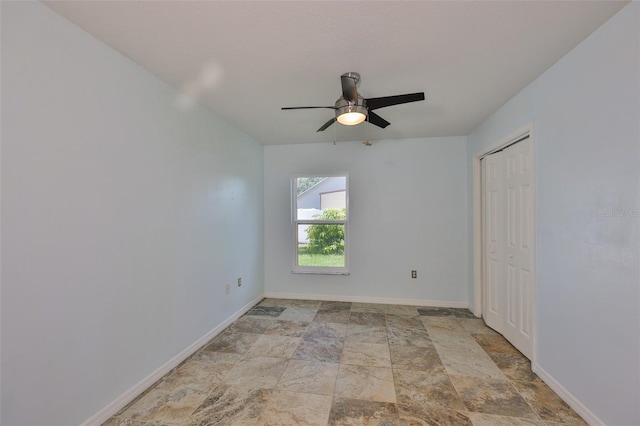 10430 Crestfield Dr, Riverview, FL 33569 - unfurnished bedroom featuring light stone finish flooring, ceiling fan, and a closet