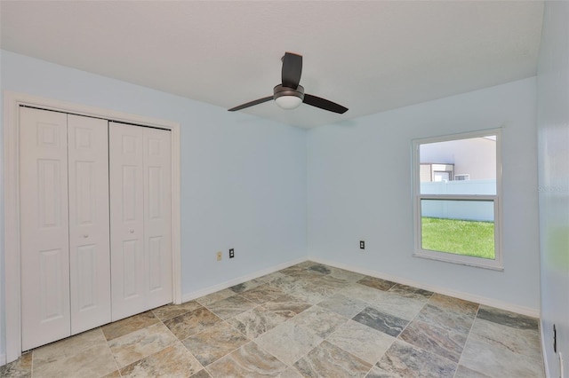 10430 Crestfield Dr, Riverview, FL 33569 - unfurnished bedroom with stone finish flooring, a closet, and a ceiling fan