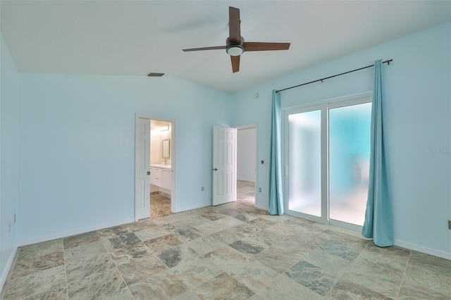 10430 Crestfield Dr, Riverview, FL 33569 - unfurnished bedroom featuring stone finish flooring, lofted ceiling, ensuite bathroom, and a ceiling fan
