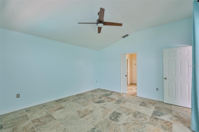 10430 Crestfield Dr, Riverview, FL 33569 - spare room featuring ceiling fan, vaulted ceiling, and stone finish floors
