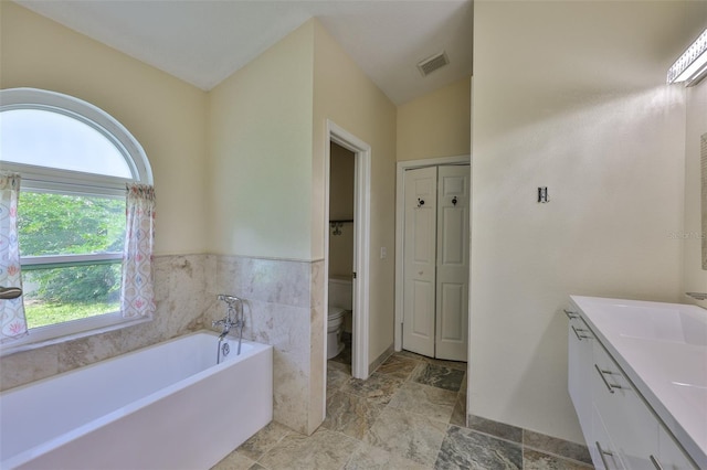 10430 Crestfield Dr, Riverview, FL 33569 - full bath featuring vanity, a bath, a closet, and stone finish floors