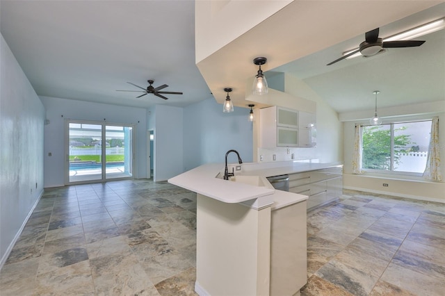 10430 Crestfield Dr, Riverview, FL 33569 - kitchen with a ceiling fan, dishwasher, white cabinetry, a peninsula, and healthy amount of natural light