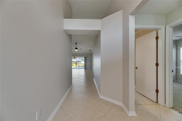 318 Lookout Dr, Apollo Beach, FL 33572 - hall featuring light tile patterned flooring and baseboards