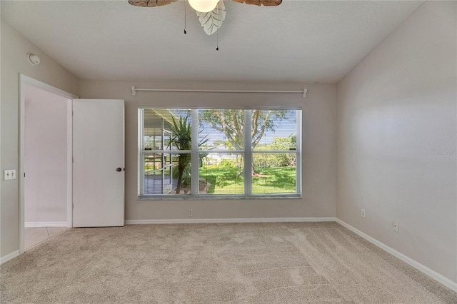 318 Lookout Dr, Apollo Beach, FL 33572 - unfurnished room with light colored carpet, a ceiling fan, and a smoke detector