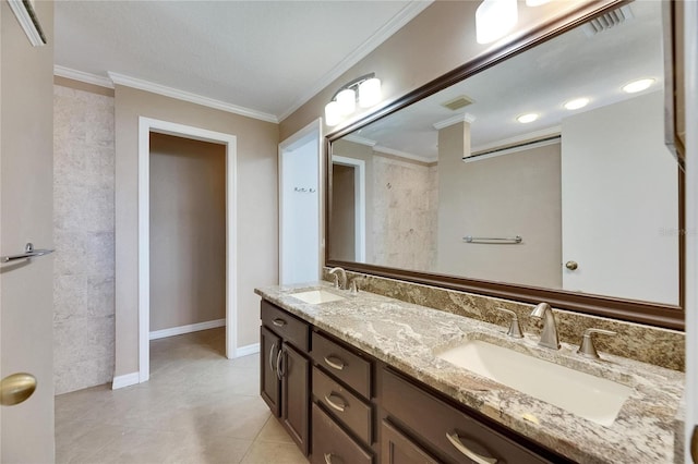 318 Lookout Dr, Apollo Beach, FL 33572 - bathroom featuring double vanity, tile patterned flooring, and crown molding